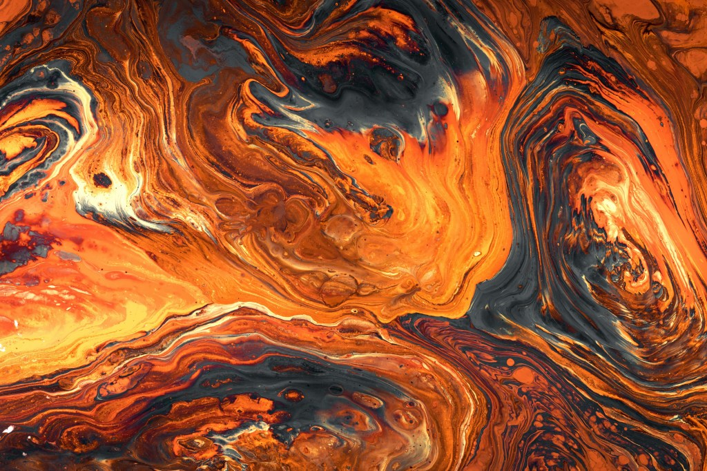 An abstract swirly pattern in orange and black.
