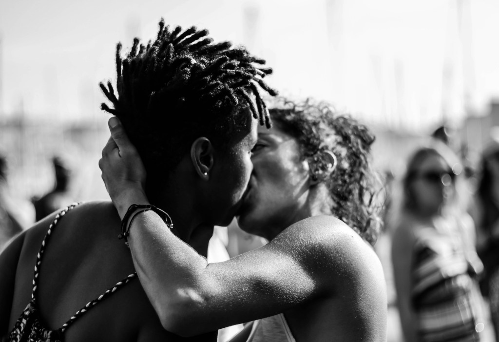 An image of two LGBTQIA people kissing
