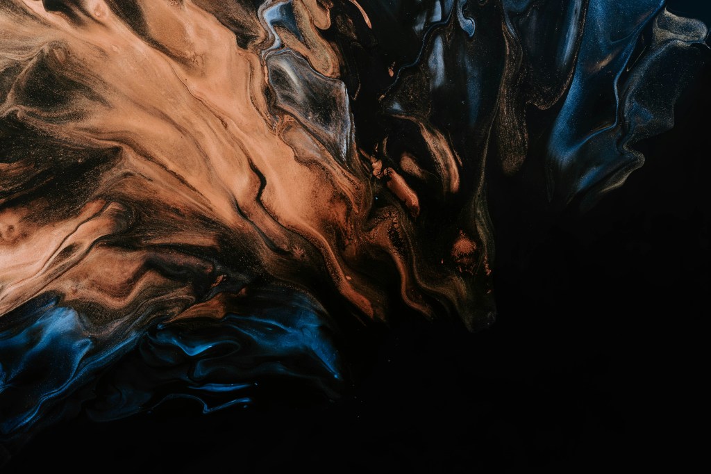 An image of swirling colours beginning to coalesce